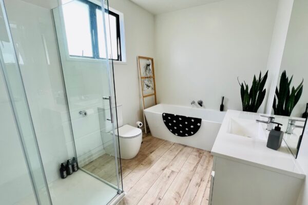 Interior-Main-bathroom-2 Main bathroom interior image containing bath, shower, toilet and sink areas