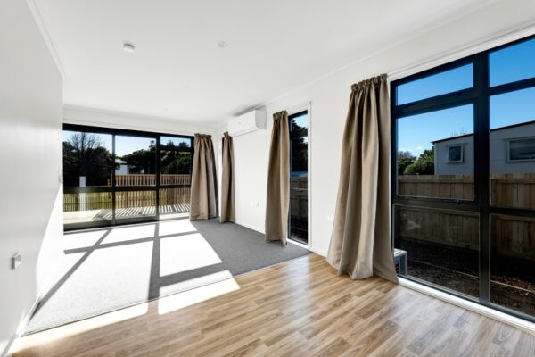 13_800px Downstairs dining and lounge space of a developer series transbuild commercial home