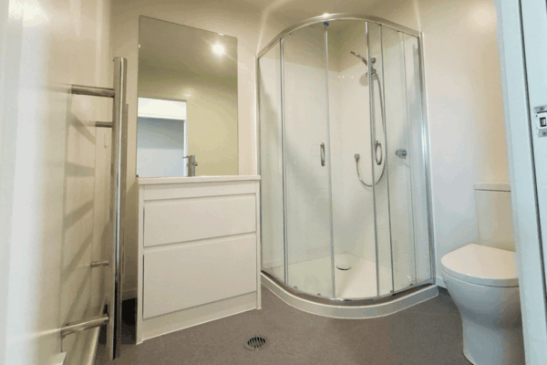 14 Transbuild Commercial Developer Series transportable home view of bathroom with shower and toilet