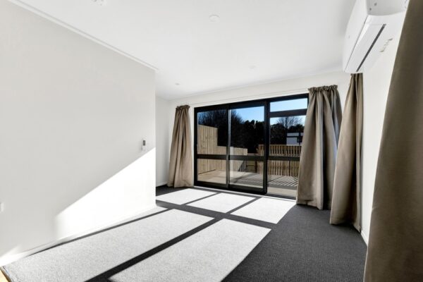 14_800px Downstairs bedroom space in a developer series transbuild commercial home