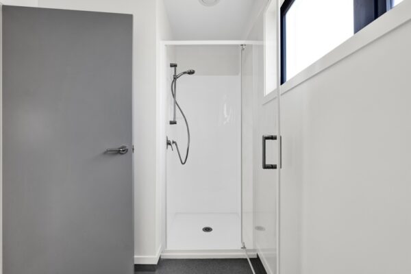 27_800px View of shower space in a developer series transbuild commercial home