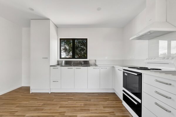 41_800px Large kitchen space with ample storage in a transbuild commercial developer series home