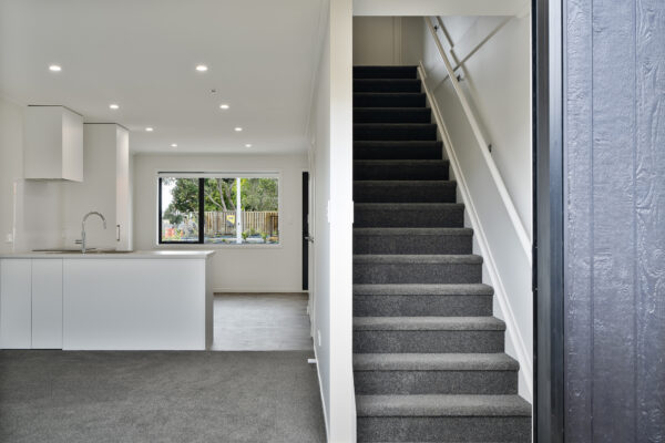 Transbuild 2B_Living_LR02 View of stairs up to second storey in a transbuild developer series home
