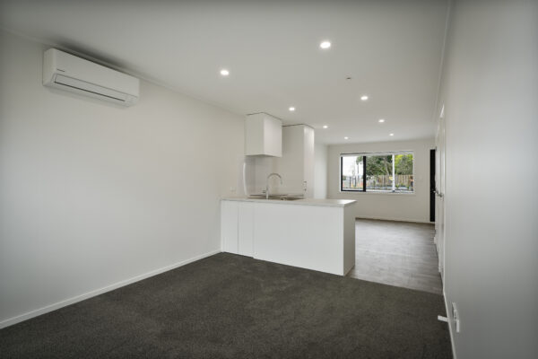 Transbuild 2B_Living_LR04 View inside the kitchen and dining space of a transbuild developer series home with heatpump
