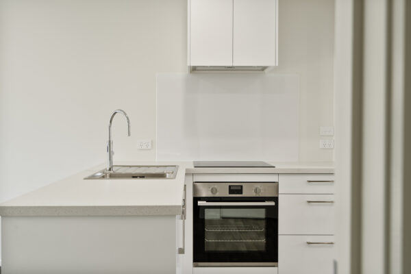 Transbuild 2B_Living_LR05 View inside the kitchen area of a transbuild developer series home