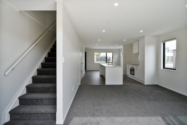 Transbuild 3B_Living_LR05 View inside a developer series home in the downstairs section of home