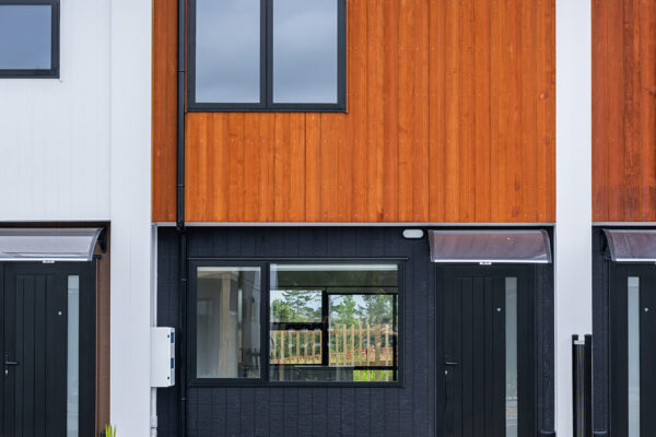 Transbuild Exterior_LR17 Transbuild Developer Series multi unit home front view with driveway entrance