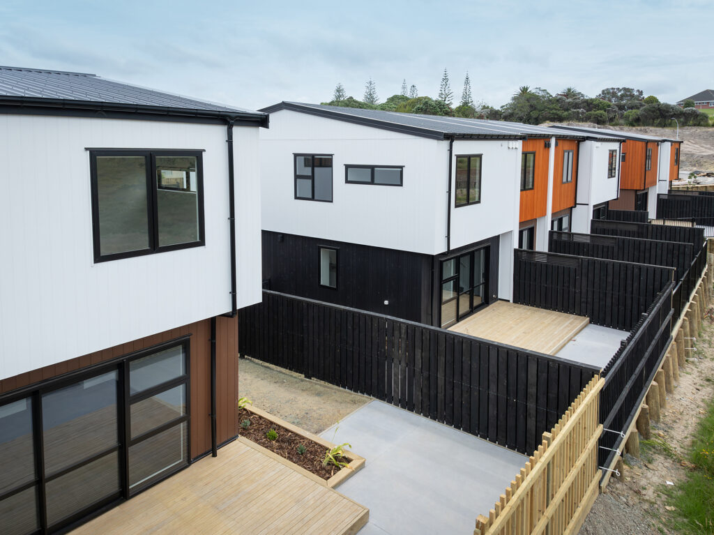 Transbuild blocks_LR13 Transbuild Developer Series housing section with birdseye view of two storey homes with backyard decks and fencing
