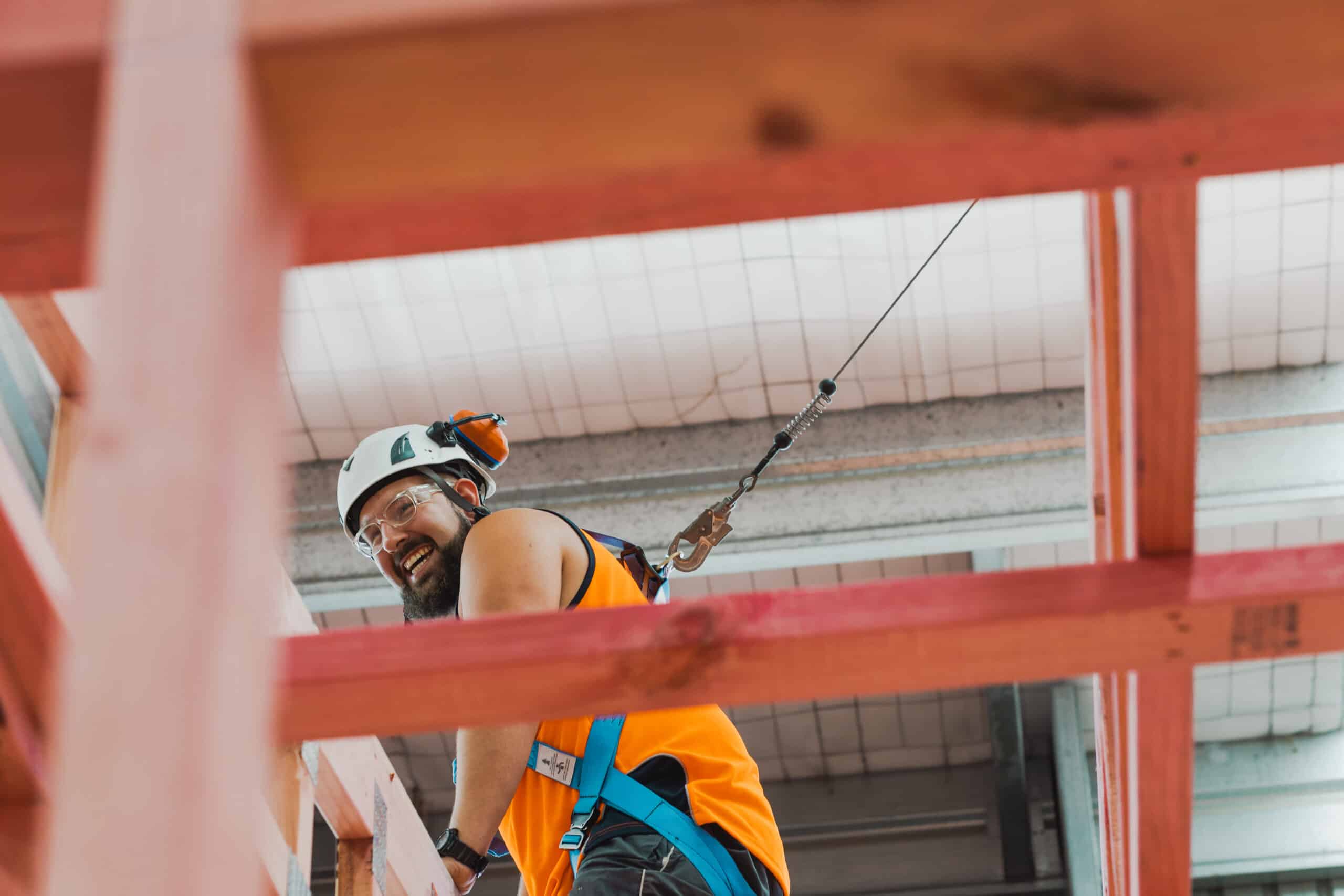 A builder on a harness for a transportable build house & land